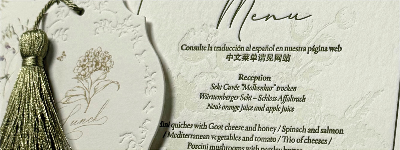 A menu card with a green tassel on it.

Description generated by AI